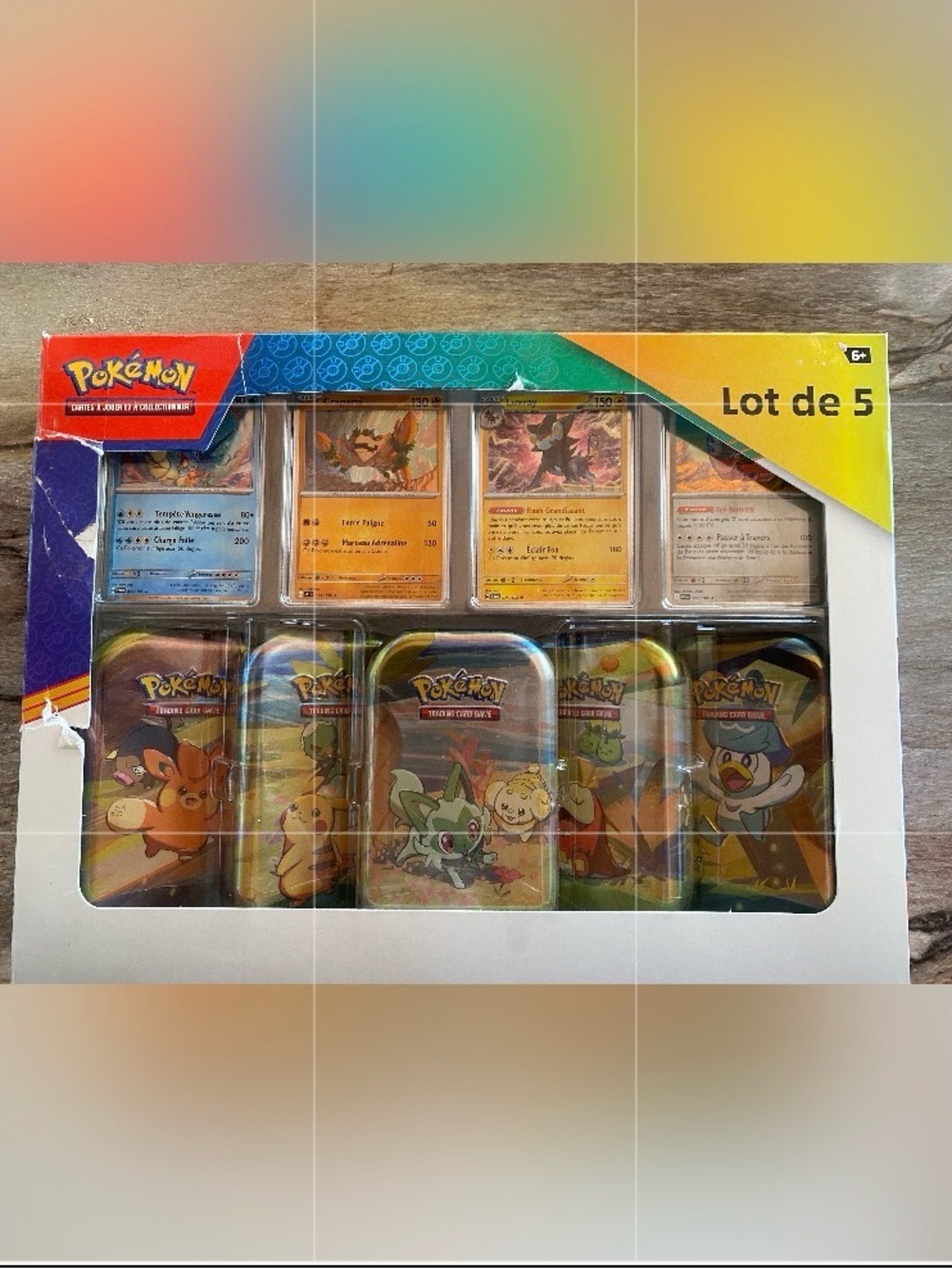 Pokemon Trading Card Game Tin Set with Red, Blue, Yellow, Purple, Green Accents